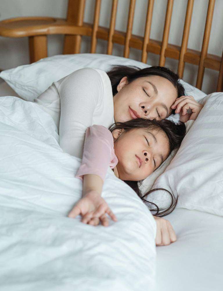 Mother caring for child with cold — paediatric ENT doctor Singapore